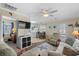 Bright living room features sofa, armchairs, and kitchen views at 6001-5137 S Kings Hwy., Myrtle Beach, SC 29575