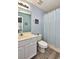 Clean bathroom with tub shower, vanity, and light blue accents at 1065 Pinwheel Loop # 1065, Myrtle Beach, SC 29577