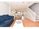 Open living area with hardwood floors and adjacent dining space at 1065 Pinwheel Loop # 1065, Myrtle Beach, SC 29577