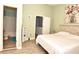 Main bedroom with ensuite bathroom and wood-look floors at 1065 Pinwheel Loop # 1065, Myrtle Beach, SC 29577