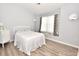 Cozy bedroom with a comfortable bed, large window, and light gray walls at 1065 Pinwheel Loop # 1065, Myrtle Beach, SC 29577