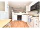 Galley kitchen with white cabinets and appliances at 1065 Pinwheel Loop # 1065, Myrtle Beach, SC 29577