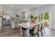 Bright dining area with white table and chairs, adjacent to kitchen at 2628 Riverboat Way, Conway, SC 29526