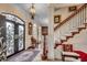 Elegant entryway with grand staircase, ornate doors, and chandelier at 153 Palmetto Harbour Dr., North Myrtle Beach, SC 29582