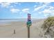 Beachfront property with signage indicating dune preservation at 5001 N Ocean Blvd. # 2-I, North Myrtle Beach, SC 29582