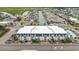 An aerial view of a two-story building near a waterway, showing the surrounding neighborhood at 5001 N Ocean Blvd. # 2-I, North Myrtle Beach, SC 29582