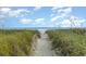 Sandy pathway meanders through beach grass to the ocean at 5001 N Ocean Blvd. # 2-I, North Myrtle Beach, SC 29582