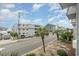 Relaxing street view with tropical plants and nearby buildings at 5001 N Ocean Blvd. # 2-I, North Myrtle Beach, SC 29582