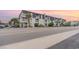 Attractive two-story building showcasing multiple units with balconies at sunset at 5001 N Ocean Blvd. # 2-I, North Myrtle Beach, SC 29582