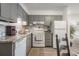 Updated kitchen featuring granite countertops and gray cabinets at 5001 N Ocean Blvd. # 2-I, North Myrtle Beach, SC 29582