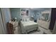 Bedroom with light teal walls and beach decor at 1048 Portico Loop # 1048, Myrtle Beach, SC 29577