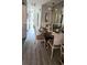 Bright dining area with glass-top table and four chairs at 1048 Portico Loop # 1048, Myrtle Beach, SC 29577