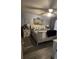 Main bedroom with a sleigh bed, coastal decor, and light wood floors at 1048 Portico Loop # 1048, Myrtle Beach, SC 29577