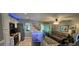 Open concept kitchen and living area with breakfast bar and gray couch at 1048 Portico Loop # 1048, Myrtle Beach, SC 29577