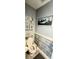Charming bathroom with beach-themed decor and wood-look walls at 1048 Portico Loop # 1048, Myrtle Beach, SC 29577