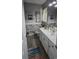 Clean bathroom with white vanity, decorative tile, and beach-themed decor at 1048 Portico Loop # 1048, Myrtle Beach, SC 29577