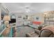 Open living space with a sleeper sofa and access to a deck at 6001 - M-58 S Kings Hwy., Myrtle Beach, SC 29575