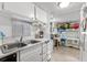 Kitchen with a double sink and a view into the bedroom at 6001 - M-58 S Kings Hwy., Myrtle Beach, SC 29575