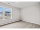 Bright bedroom with carpeted floor, neutral walls, and a window offering a view at 705 Lightwood Dr., Conway, SC 29526