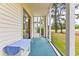 Relaxing screened porch overlooking a grassy yard at 472 River Oaks Dr. # 65C, Myrtle Beach, SC 29579