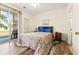 Primary bedroom with wood floors and access to patio at 472 River Oaks Dr. # 65C, Myrtle Beach, SC 29579