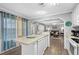 Open concept kitchen with island and breakfast bar, overlooking living room at 6001 - Mh202 S Kings Hwy., Myrtle Beach, SC 29575
