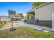 Backyard with basketball court and partially covered patio at 6001 - Mh202 S Kings Hwy., Myrtle Beach, SC 29575
