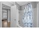 Bathroom with a tub shower and patterned curtain at 6001 - Mh202 S Kings Hwy., Myrtle Beach, SC 29575