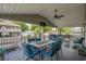 Covered patio with seating, dining, and a TV for outdoor entertainment at 6001 - Mh202 S Kings Hwy., Myrtle Beach, SC 29575