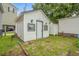 White shed with blue shutters in backyard at 6001 - Mh202 S Kings Hwy., Myrtle Beach, SC 29575