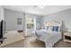 Guest bedroom with a queen bed and beach decor at 6001 - Mh202 S Kings Hwy., Myrtle Beach, SC 29575