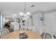 Open kitchen with white cabinets, island, and view into the living room at 6001 - Mh202 S Kings Hwy., Myrtle Beach, SC 29575