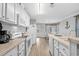 Bright kitchen with white cabinets, stainless steel appliances, and island at 6001 - Mh202 S Kings Hwy., Myrtle Beach, SC 29575