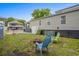 Relaxing backyard with fire pit and seating, plus a large grassy area at 6001 - Mh202 S Kings Hwy., Myrtle Beach, SC 29575