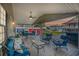 Relaxing covered patio furnished with comfortable seating and dining area at 6001 - Mh202 S Kings Hwy., Myrtle Beach, SC 29575