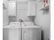 Laundry room with washer, dryer, and overhead cabinets at 6001 - Mh202 S Kings Hwy., Myrtle Beach, SC 29575