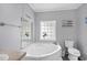 Bathroom with corner bathtub, toilet, and vanity at 6001 - Mh202 S Kings Hwy., Myrtle Beach, SC 29575