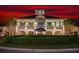 Attractive building exterior with landscaping and nighttime lighting at 100 North Beach Blvd. # 306, North Myrtle Beach, SC 29582