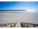 Steps leading to a pristine beach with white sand and ocean views at 100 North Beach Blvd. # 306, North Myrtle Beach, SC 29582