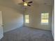 Spacious bedroom with plush carpeting and large windows at 4731 Huckleberry Ln., Conway, SC 29526