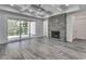 Spacious living room with fireplace, high ceilings, and sliding glass doors at 1817 Woodstork Dr., Conway, SC 29526