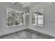 Bright dining room with hardwood floors and large windows at 1817 Woodstork Dr., Conway, SC 29526