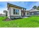 Home's exterior boasts a charming design and lush green lawn at 1817 Woodstork Dr., Conway, SC 29526