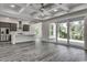 Open living area featuring hardwood floors, high ceilings and sliding glass doors at 1817 Woodstork Dr., Conway, SC 29526
