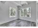 Spacious dining area with hardwood floors and large windows offering natural light at 1817 Woodstork Dr., Conway, SC 29526