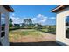 View of the backyard, showing neighboring homes and a pond at 1817 Woodstork Dr., Conway, SC 29526