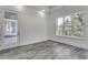 Spacious bedroom with wood-look floors and access to a porch at 1817 Woodstork Dr., Conway, SC 29526