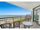 Balcony overlooking the ocean with table and chairs at 7200 N Ocean Blvd. # 853, Myrtle Beach, SC 29572