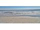 Oceanfront view with waves gently rolling onto the sandy shore at 7200 N Ocean Blvd. # 853, Myrtle Beach, SC 29572