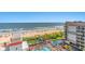 Oceanfront view of building, pool, and beach at 7200 N Ocean Blvd. # 853, Myrtle Beach, SC 29572